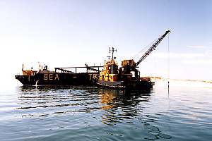 Sand dredging barge and tug