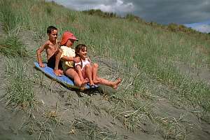 f990424: beach fun, sliding off the dunes