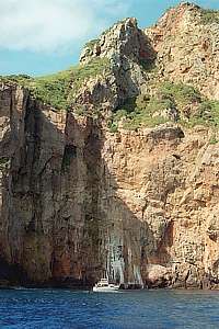 steep cliff dwarfs yacht