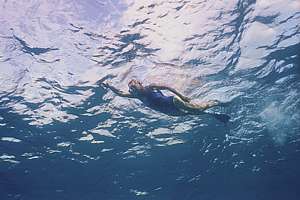 swimming in Niue's clear blue sea